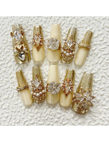 Luxury gold manicure, swirling Swarovski
